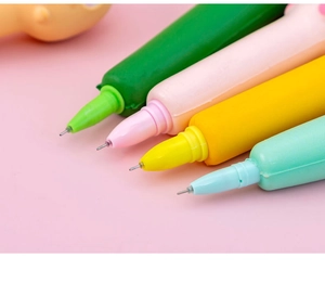 Close-up of colorful cartoon animal squeeze pens in green, pink, yellow and blue colors