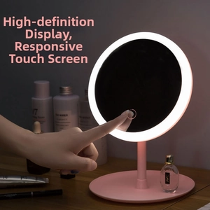 Detail of pink LED makeup mirror showing sensitive touch control sensor for brightness