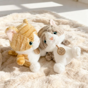 Pair of fluffy realistic plush cats in orange and grey stripes with honey wood tags