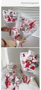 Gros plan du bouquet de peluches Père Noël avec pommes de pin et papier festif