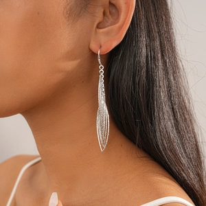 Silver leaf tassel earrings with multi-layer fine chains shown on a female model