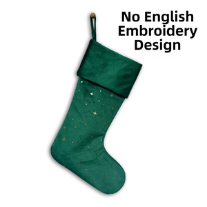 Detail of dark green velvet Christmas stocking with gold star foil print and hanging loop