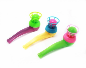 Detailed view of three colorful retro floating ball pipe toys on white background