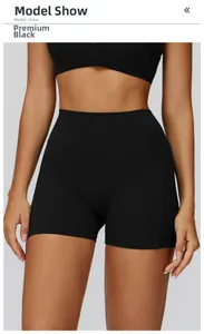 Macro shot of high-waist yoga shorts in premium black featuring reinforced side seams