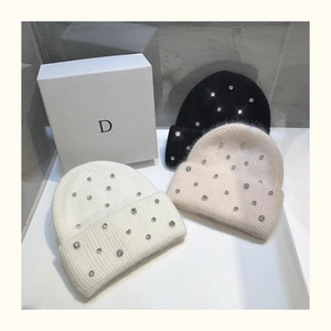 Detailed texture of rabbit fur blend knit hat with sparkling rhinestones and gift box