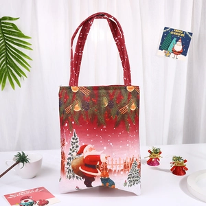 Christmas Santa Claus canvas gift bag with red festive prints and sturdy handles