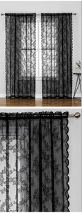 Detailed view of elegant black lace curtains with floral patterns and sheer texture