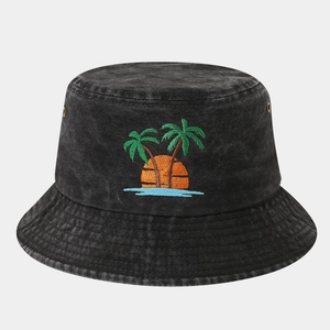 Detailed close-up of palm tree embroidery on washed black denim bucket hat
