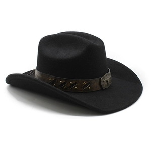 Detail of black cowboy hat with brown leather band, rivets and metallic bull head buckle