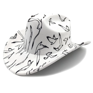 White Western cowboy hat with black bird print shown in a professional studio view
