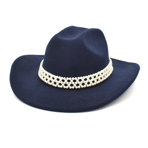 Close-up of a navy wool cowboy hat featuring an elegant multi-layer pearl beaded band decoration