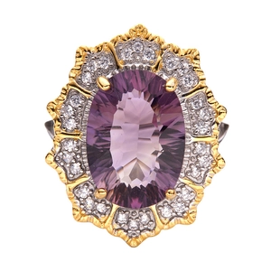 Detailed macro view of an oval cut purple amethyst stone with diamond halo on silver band