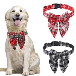 Detail of adjustable plaid pet bow tie collars in red and green for large dogs