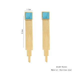 Macro detail of long tassel earrings with blue stone and dimension labels in 8.6cm length