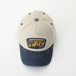 Kids contrast baseball cap featuring beige body and navy brim with excavator embroidery