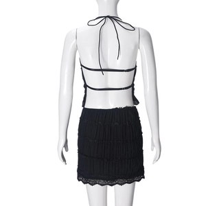 Back view of sexy black backless top and layered ruffle skirt with delicate lace detail