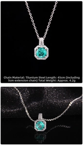 Detailed view of emerald green crystal pendant necklace with titanium steel chain specs