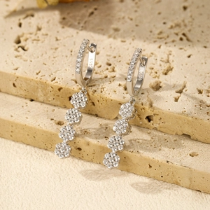 Elegant S925 sterling silver drop earrings with sparkling flower crystals on stone surface
