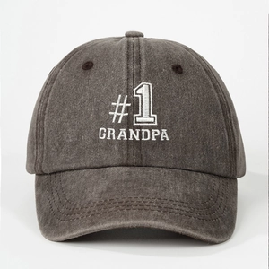 Close-up of #1 GRANDPA embroidery on washed dark gray cotton canvas baseball cap