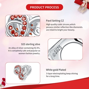 Macro view of S925 sterling silver heart charm with red zircon and MOM engraving
