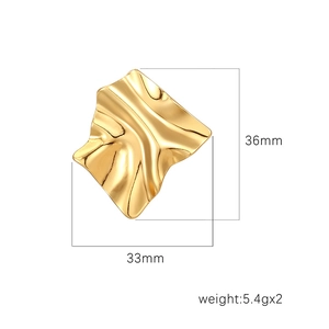 Detail view of irregular gold earrings with 36mm x 33mm dimensions and 5.4g weight