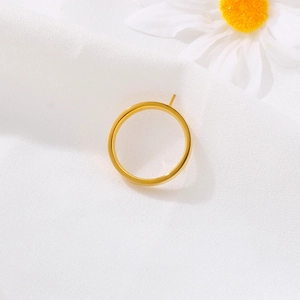 Golden stainless steel ring base with setting pin for DIY jewelry making on white fabric