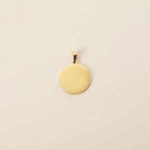 Polished gold circular pet tag with bail clasp on clean background for laser logo