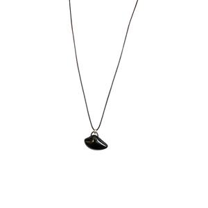 Minimalist irregular black stone pendant necklace with polished mirror finish and wax rope