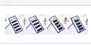 Detail of black metal bob pins in waved and smooth styles on blue display cards