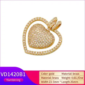 Golden heart pendant with paved evil eye crystal and brass measurements 23mm x 26mm