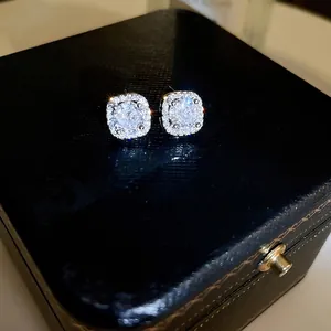 Elegant square cubic zirconia stud earrings with halo design on black jewelry box