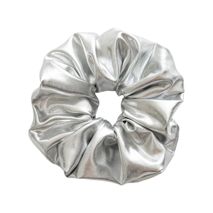Minimalist silver metallic scrunchie with shiny pleated faux leather texture for hair