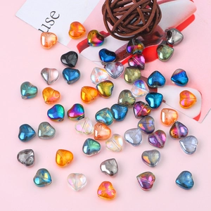 Detailed macro view of 10mm colorful heart-shaped glass crystal beads for DIY jewelry making