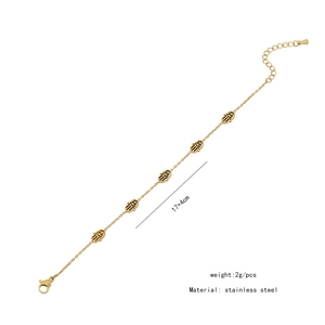 Detailed view of gold Hamsa Hand bracelet with evil eye charms and length dimensions