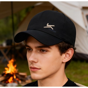 Detail of premium black twill cotton baseball cap featuring high-quality white embroidery