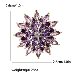 Elegant gold flower brooch with purple crystals and dimensions 2.6cm by 2.6cm