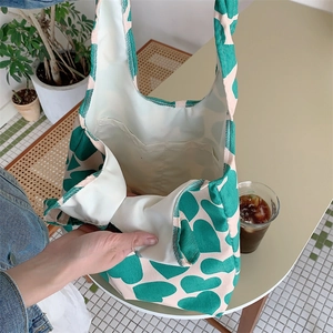Detail view showing inner lining and small pocket of corduroy heart tote bag