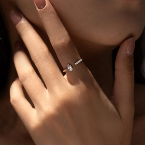 S925 sterling silver open ring with pear shaped crystal and pave setting on finger