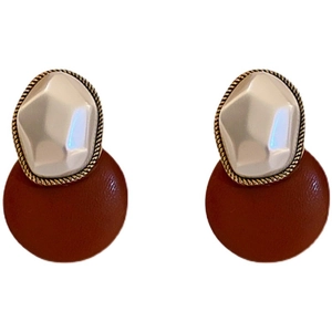Vintage geometric earrings with faux leather disks, white pearls, and gold-tone metal studs