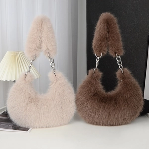 Plush faux fur crescent bags with chain straps in off-white and brown colors