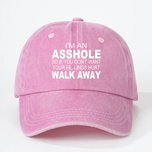Detail of screen-printed slogan on washed pink cotton baseball cap with white background