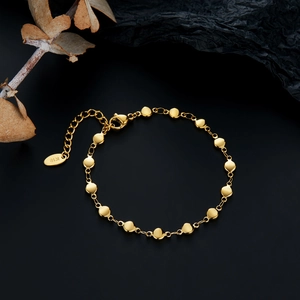 18K gold plated stainless steel disc chain bracelet with lobster clasp on dark background