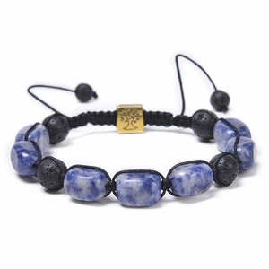 Detail of blue natural stones and black lava beads with golden tree of life charm