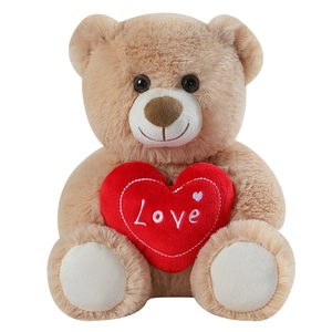 Cute light brown teddy bear plush holding a red Love heart, professional studio white background