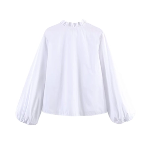 Back view of white poplin shirt featuring stylish tiered ruffles and lantern sleeves