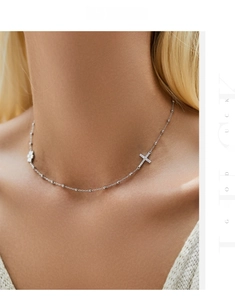 Detail of s925 silver beaded choker featuring a micro-pave cross and daisy pendant
