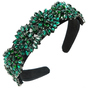 Detail of luxury emerald green crystal clusters on black velvet headband