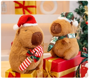 Detail of Christmas Capybara plush toys with festive red hats and scarves in a gift scene