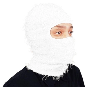 Detail of white knitted balaclava with unique distressed fringe and warm thermal texture
