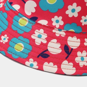 Floral bucket hat in rose red with blue and white flowers and reinforced stitching